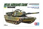 Tamiya 1/35 scale M1A1 Abrams Tank Ukraine model kit box art showing a camouflaged tank with white cross markings.