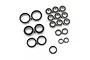 A collection of various sized metal ball bearings with black rubber seals arranged on a white background.