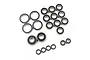 A collection of various sized rubber shielded ball bearings arranged on a white background.