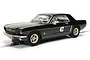 A 1/32 scale Scalextric Ford Mustang slot car in black with gold racing stripes and the number 47 on the side, displayed on a slot car track.