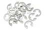 A pile of small, silver-coloured stainless steel E-clips used for RC hobby applications.