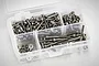 A clear plastic storage box filled with various sizes of stainless steel RC screws and nuts, viewed from above against a white background.