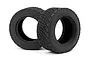 Two black rubber RC rally tyres with a blocky tread pattern, shown from a front-quarter angle against a white background.