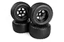 Four HPI Ground Assault RC truggy tyres mounted on black Scorch rims, stacked against each other on a white background.