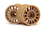 Two bronze-coloured 1.9-inch rally-style RC car rims from HPI Racing, shown from a front-facing angle on a white background.
