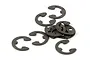 A small pile of dark grey metal E-clips for RC car maintenance.