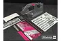 Clear unpainted Bittydesign Vision RC8B3 body shell with decal sheets and promotional card on a dark surface.