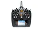 Front view of the Spektrum NX8 8-channel RC transmitter with a black casing, orange accents, and a backlit LCD screen showing airplane telemetry.