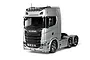 A silver Tamiya Scania 770 S 6x4 RC truck model kit, viewed from a front three-quarter angle against a white background.