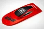 A red UDI RC boat outer cabin cover with black accents and branding, viewed from a high angle on a white background.