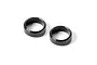 Two small black aluminium steering arm shims or spacers for RC cars, shown against a plain white background.