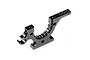 A black anodized aluminium lower bulkhead part for an XRAY RC car, showing mounting holes and a curved gear housing section.