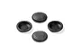 Four black rubber shock absorber membranes for RC cars arranged on a white background.