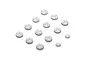 A collection of white composite RC shock pistons with various hole configurations arranged on a white background.