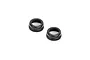 Two black aluminium shock absorber cap nuts for RC cars, shown from a top-down angle against a white background.