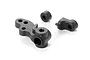 XRAY composite steering block with three holes and separate backstop components on a white background.