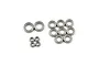 A collection of metal shielded ball bearings of varying sizes arranged on a white background.