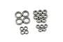 A collection of various sized metal shielded ball bearings arranged on a white background.