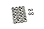 A collection of metal shielded ball bearings of various sizes arranged on a white background.
