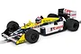 A 1/32 scale Scalextric Williams FW11 slot car in blue, yellow, and white livery with Canon and Mobil 1 branding, positioned on a slot car track.