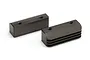 Two black metal Kyosho engine mounts with threaded holes, one featuring cooling fins, isolated on a white background.