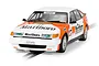 Scalextric 1/32 scale 1985 Rover SD1 slot car in white and orange Marlboro livery on a track.