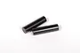 Two small, cylindrical black metal pins lying on a plain white background.