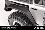 Close-up of an RC crawler rear fender flare installed on a silver vehicle body with a black tire and wheel.