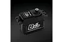 Power HD B4S brushless metal geared servo in black aluminium casing, viewed from a high angle against a dark textured background.