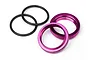 Two purple anodized aluminium shock spring adjuster nuts and two black rubber O-rings on a white background.