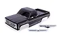 A black Traxxas 1979 Chevrolet K10 RC truck body shell with chrome bumpers on a white background.