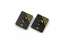 Two rectangular Yeah Racing 10g brass chassis balancing weights with black coating and central mounting holes.