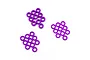 A collection of purple anodized aluminium flat washers arranged in three small groups against a plain white background.