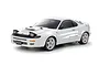 A studio shot of a white Tamiya Toyota Celica GT-Four ST185 RC car model on a white background.