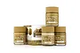 A set of four Mr. Hobby Dark Yellow Colour Modulation acrylic paint jars with a small instruction box featuring a tank model.