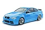 A light blue MST RMX 2.5 E92 RC drift car on a white background, featuring a detailed BMW E92 coupe body shell and chrome-rimmed wheels.