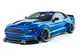 A blue 1/10 scale MST RMX 2.5 LBMT RC drift car featuring a wide-body Ford Mustang style shell, black wheels, and a front splitter.