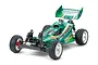 A studio shot of a Tamiya Top Force 1/10 scale 4WD electric RC buggy, featuring a metallic green body, white wheels, and off-road spike tires.