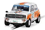 Scalextric 1/32 scale Mini 1275GT slot car in white and orange livery with number 63 and Datapost branding on a track.