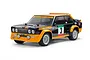 A 1/10 scale Tamiya Fiat 131 Abarth Olio rally RC car model, featuring a black and yellow livery with racing decals, on a white background.