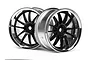 Two HPI Work XSA 02C RC car rims featuring a black multi-spoke design with a reflective chrome outer lip, set against a plain white background.