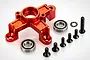 A red anodized aluminium clutch tripod mount for RC cars, including two ball bearings, six black screws, and one star washer on a white background.
