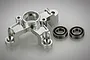 A silver aluminium clutch tripod mount for an RC car, shown with two ball bearings on a white background.