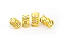 Four yellow XRAY RC shock springs arranged on a white background.