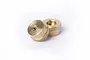 Two small, round brass weights for RC cars, each marked with 5g, sitting on a white background.