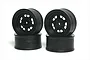 Four black RC car wheels stacked in two pairs against a white background.