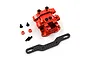 A red anodized aluminium gearbox cover for a Tamiya TT-02 RC car, including a carbon fibre shock mount and various mounting screws and spacers.