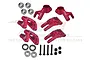 A set of red anodized aluminium RC car hub carriers and steering knuckles with included bearings, screws, and lock nuts.
