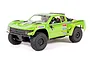 A studio shot of the Axial Yeti SCORE 1/10 scale RC short course truck in bright green with black off-road tires and sponsor decals.