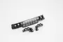 Black plastic RC car front grille and light cup components on a white background.